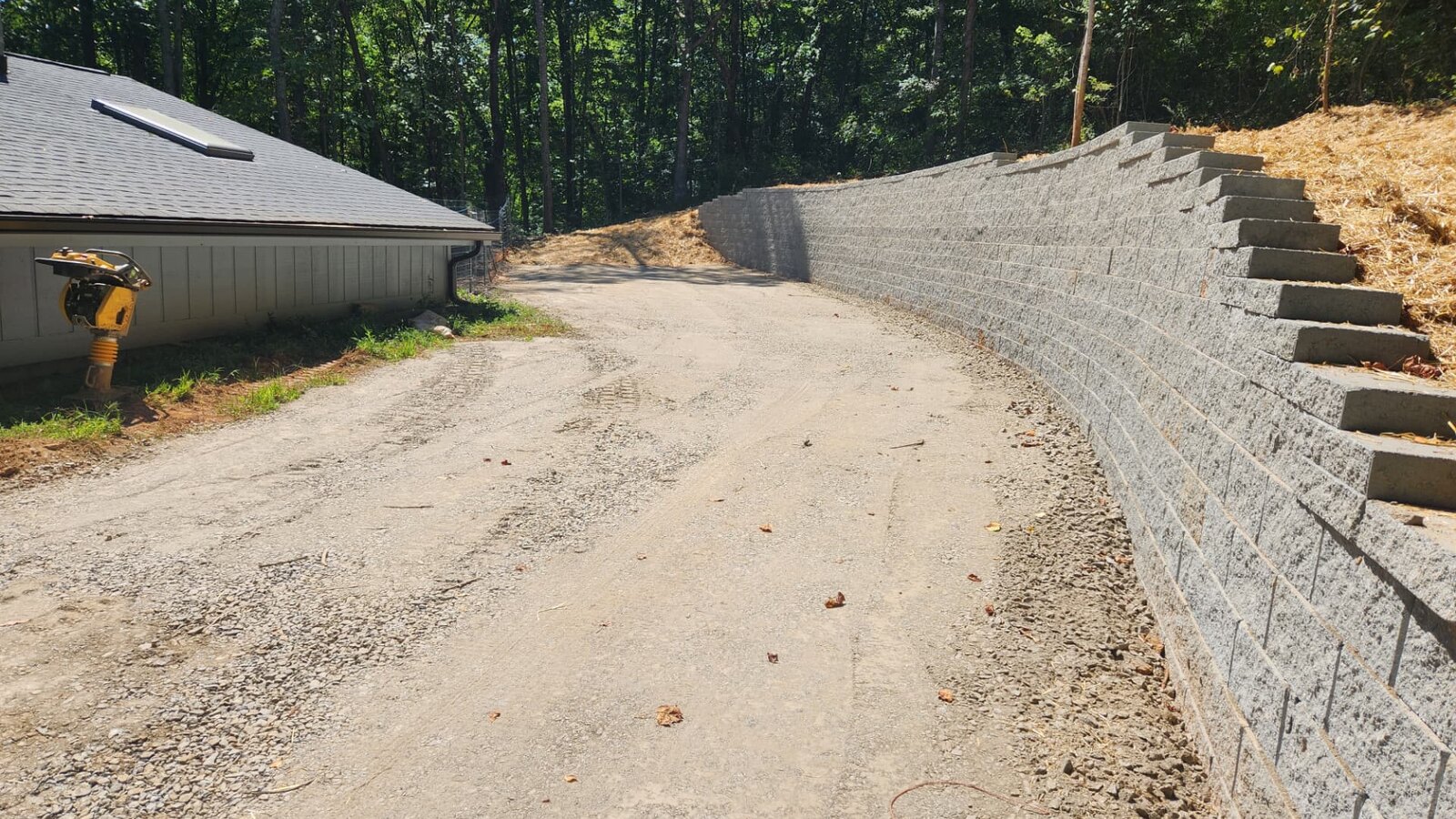 Completed concrete driveway and graded site in Western North Carolina