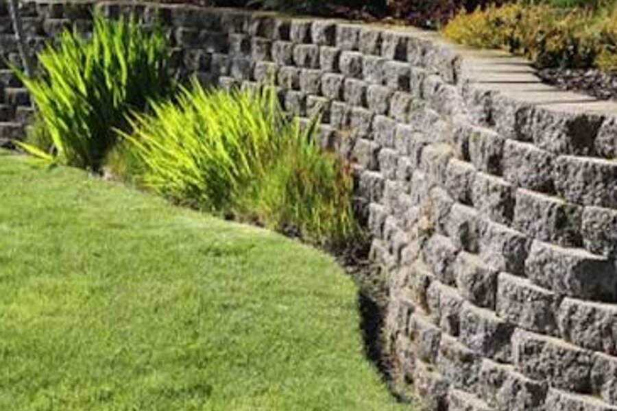 Terraced block retaining wall stabilizing a backyard slope in Black Mountain, NC